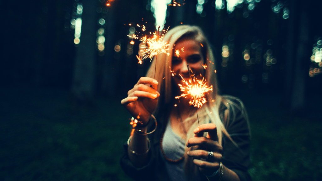 Woman celebrating in woods