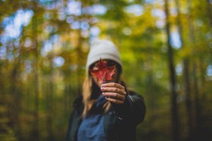 woman holding maple leaf