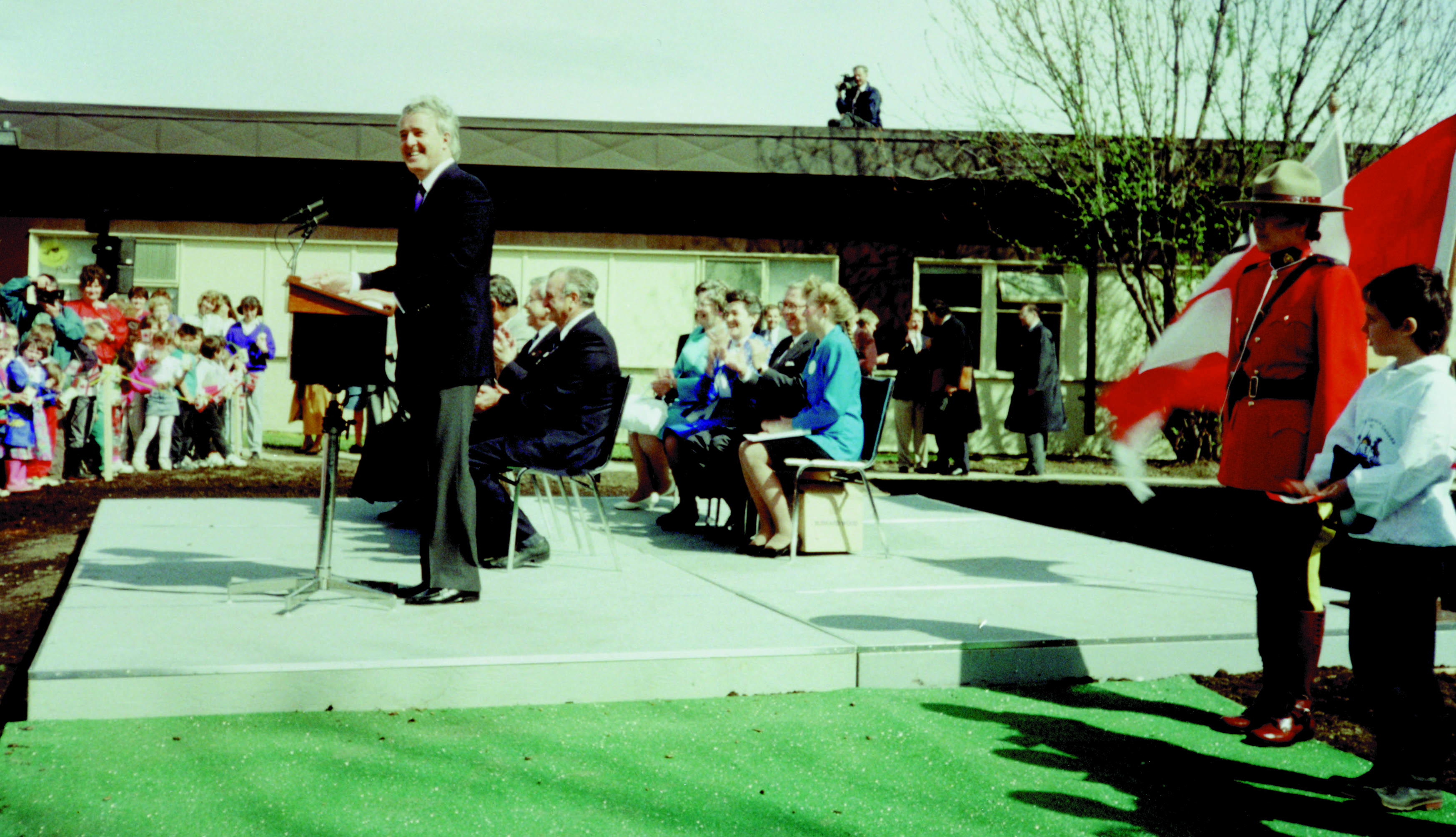 Brian Mulroney standing at a podium